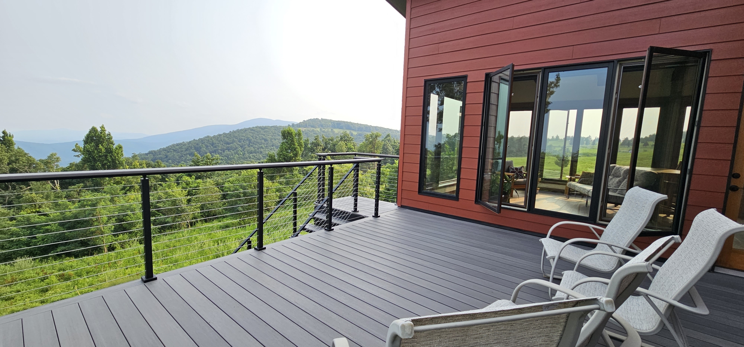 custom home exterior composite deck with view into mountains