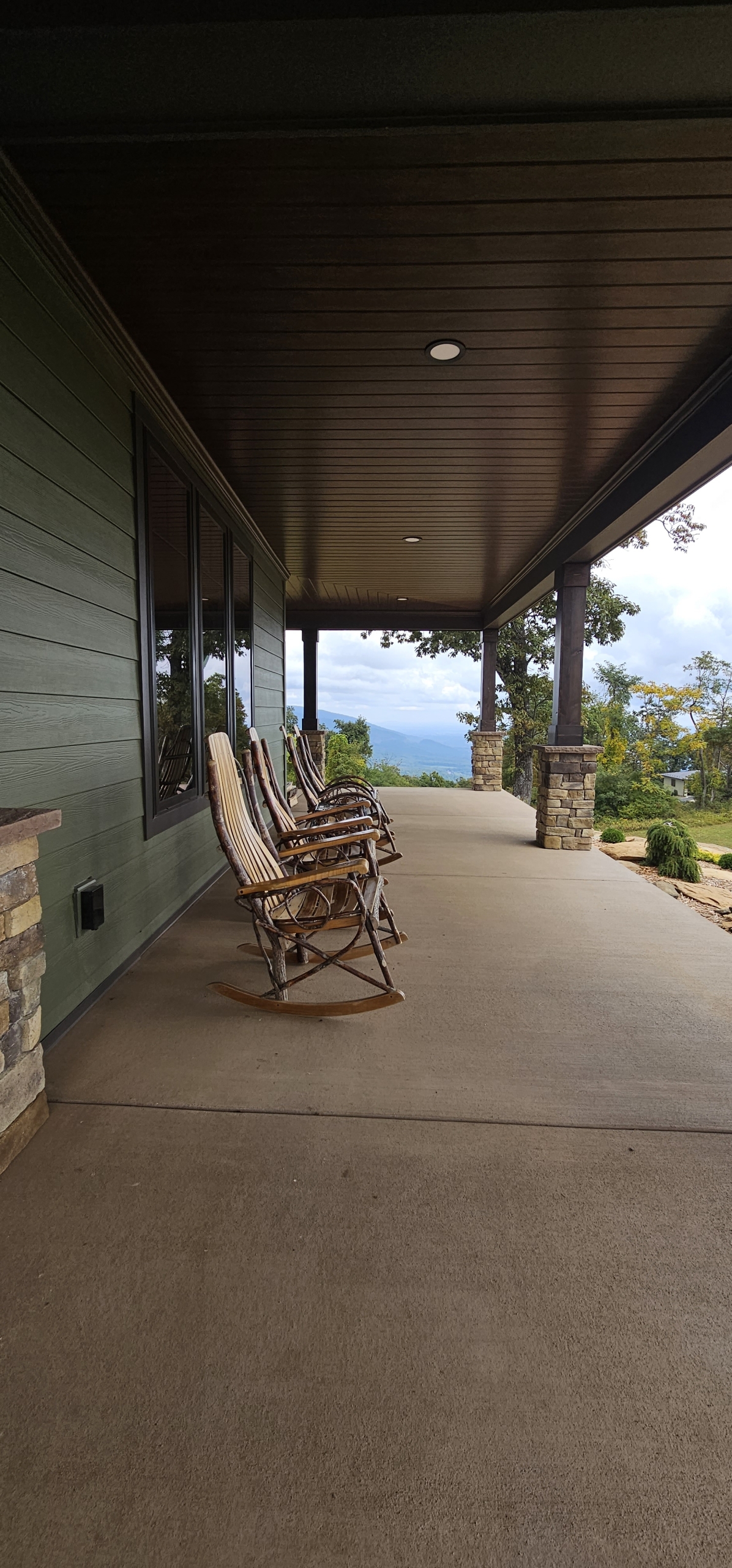 rocking chairs on front porch with view into the blue ridge mountains