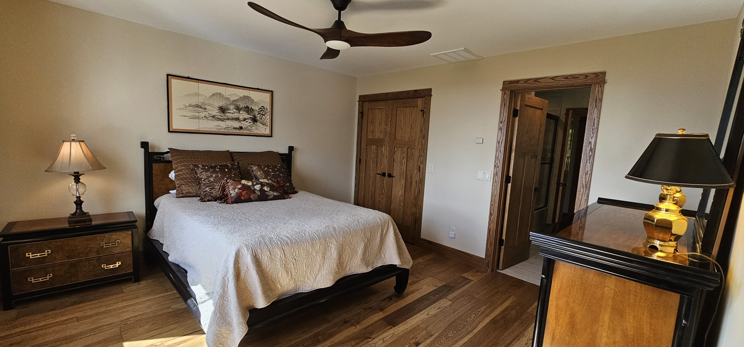 bedroom showing wood doors with craftsman style trim