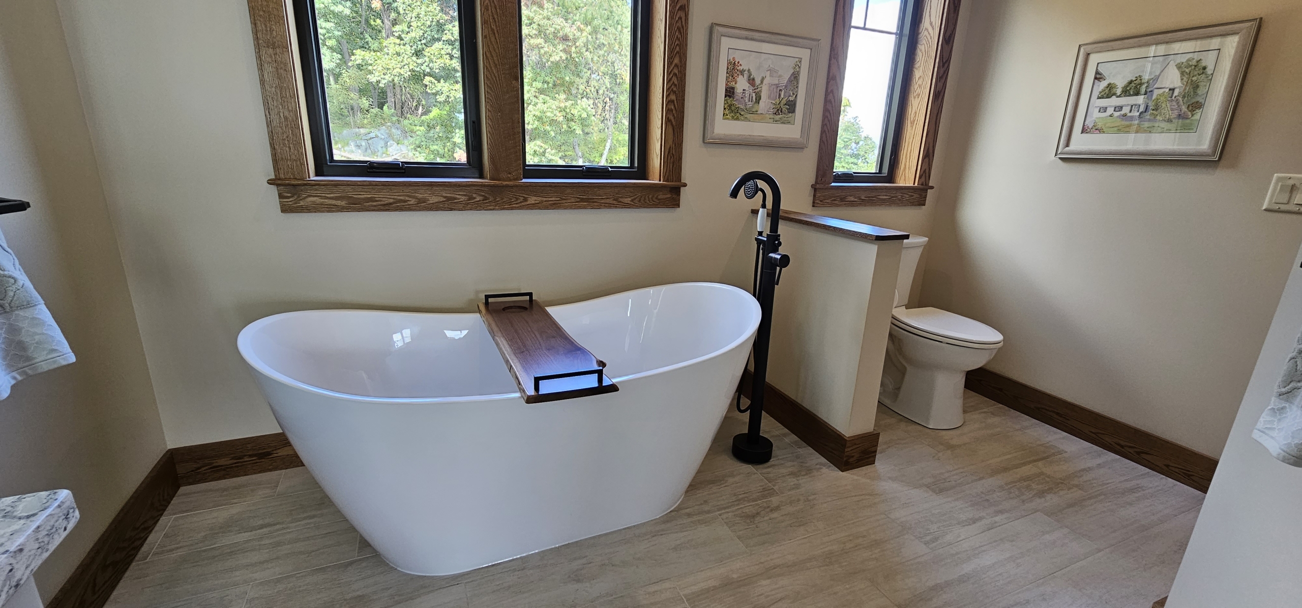 free standing bathtub with window